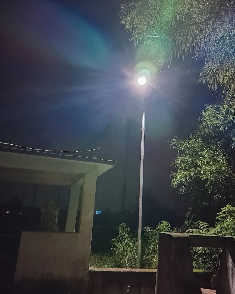Solar street light lit at night in Kusaraba village Odisha